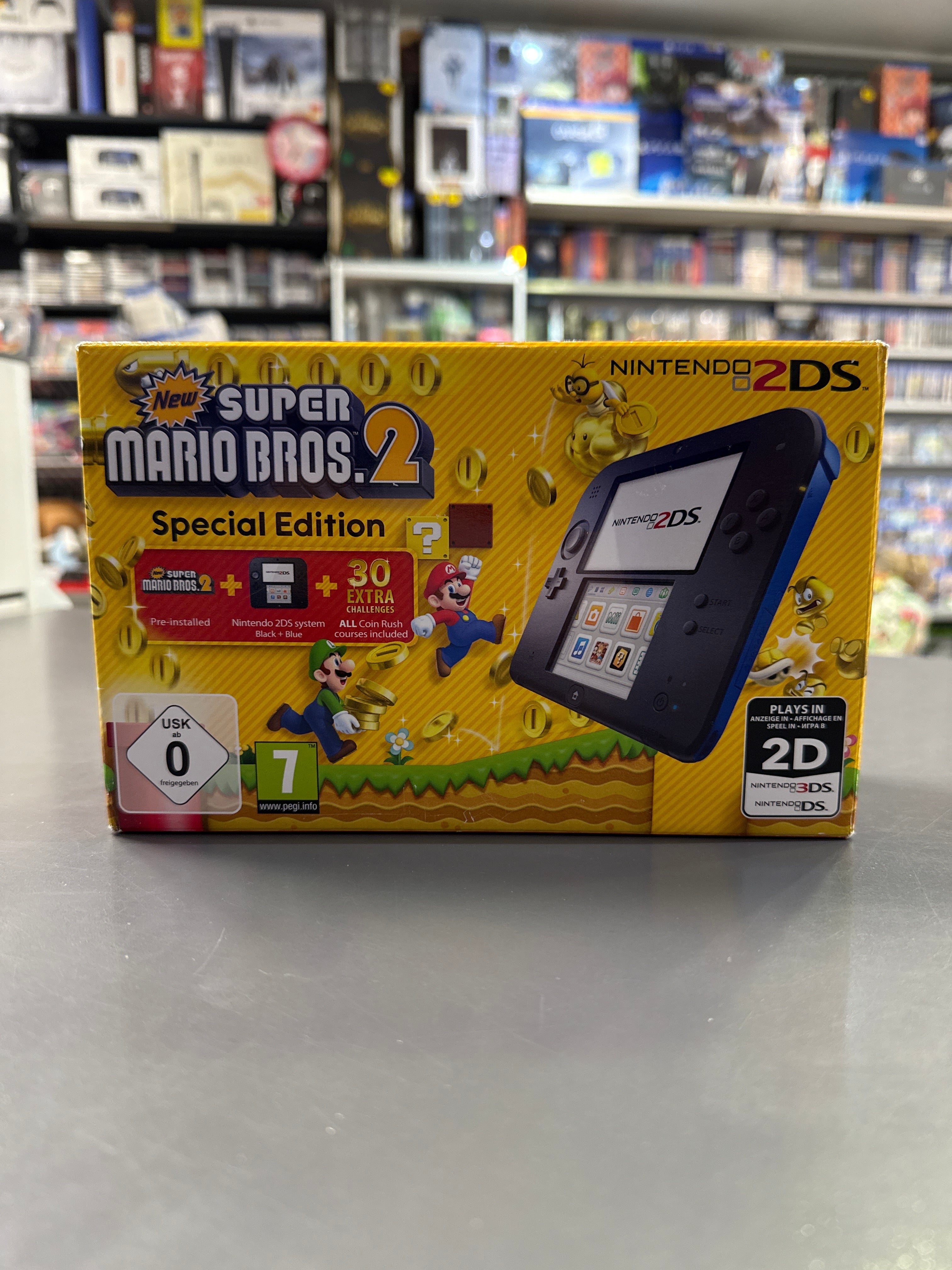 Nintendo 2DS Konsole in Schwarz mit New Super Mario Bros. 2 und Originalverpackung im tollen gebrauchten Zustand.